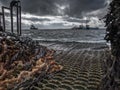 Stormy Pier With Rusty Chains