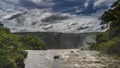 A stormy river flows in the rainforest. Water foams