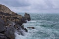 Stormy sea with big waves and black rocks Royalty Free Stock Photo