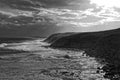 Stormy sea at rocky coast black-and-white Royalty Free Stock Photo