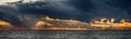 Stormy sea under dark stormy sky with fata morgana on the horizon