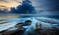 Stormy seascape with lone photohrapher at the Tip of Borneo, Malaysia