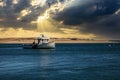 Stormy skies over a fishing boat off the coast of Chatham, Cape Cod, Massachusetts Royalty Free Stock Photo