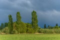 Stormy skies over a meadow in rainy spring weather Royalty Free Stock Photo