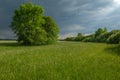 Stormy skies over a meadow in rainy spring weather Royalty Free Stock Photo