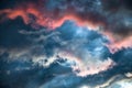 A stormy sky with a bright red glow. Colorful image of dramatic cloudscape.