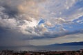 Stormy sky with dark clouds over the city and sea from above Royalty Free Stock Photo