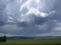 Stormy sky with dark clouds. Storm and rain over the village. Summer landscape with a thunderstorm front in the countryside Royalty Free Stock Photo