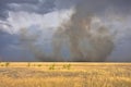 Stormy sky in the field, thunderstorm in the steppe, fire in the steppe