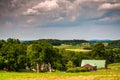 Stormy sky over a barn and farm fields in rural Southern York Co Royalty Free Stock Photo