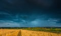 Stormy sky over field Royalty Free Stock Photo