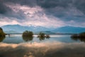 Stormy sky over the lake and mountaines with snow Royalty Free Stock Photo