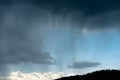 Stormy sky and rain over the pine forest - Italian Alps