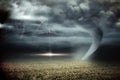 Stormy sky with tornado over field Royalty Free Stock Photo