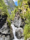 A stormy stream of a mountain river rushing among the cliff, Buryatia, Russia Royalty Free Stock Photo