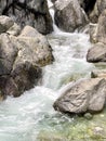 A stormy stream of a mountain river rushing among the stones Royalty Free Stock Photo