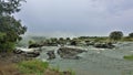 The stormy streams of the Zambezi River are approaching the abyss. Royalty Free Stock Photo