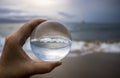 Stormy Surf on Beach Captured in Glass Ball Reflection Royalty Free Stock Photo