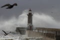 Stormy wave splash and spray at old lighthouse Royalty Free Stock Photo