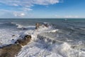 Splashing waves against rocks. Ligurian sea. Italy