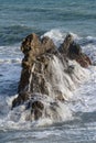 Splashing waves against rocks. Ligurian sea. Italy