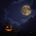 Stormy weather with a glowing jack o lantern in the background, pumpkin, lantern, storm Royalty Free Stock Photo