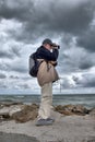 Photographer at the beach of  San Benedetto del Tronto, Ascoli Piceno, March Royalty Free Stock Photo