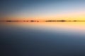 Beautiful sunset and afterglow reflection Uyuni salt flats Royalty Free Stock Photo