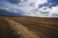 Stormy weather over a wheat field just after the harvest. Royalty Free Stock Photo