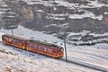 Train in Kleine Scheidegg under Eiger, Monch and Jungfrau peaks in Swiss Alps, Berner Oberland, Grindelwald,