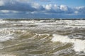 Stormy weather seascape, big waves with foam, low dark cumulus clouds, stormy sea view Royalty Free Stock Photo