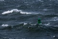 Green buoy in sea water