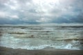 Stormy windy seascape and sunny sky with dark blue clouds Royalty Free Stock Photo