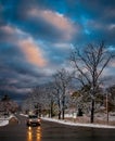 Stormy Winter Morning with Car lights reflecting off wet roads