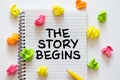 THE STORY BEGINS text in copybook. Female hands writing note in Notepad. Handwritten text