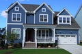 Two-story, blue, suburban home in a neighborhood in North Carolina