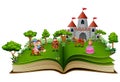 Story book with cartoon princesses and princes in front of a castle Royalty Free Stock Photo