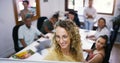 The story of our success starts here. a young businesswoman having a brainstorming session with her colleagues in a Royalty Free Stock Photo