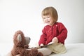 Story time. Little girl playing school with toys teddy bear and doll. children education and development, happy childhood