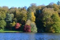 Colourful Leaves and Blue Lake -Stourhead Garden in Autumn, Wiltshire, UK Royalty Free Stock Photo