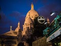 Stout beer sign in foreground, illuminated Sacre C