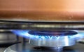 Stove flame detail. Closeup on blue fire in the kitchen. Cooking, preparing food