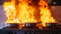 A stove with two pots on top of it on fire Royalty Free Stock Photo