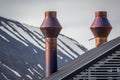 Stovepipe chimneys on top of roof in Longyearbyen, Norway Royalty Free Stock Photo