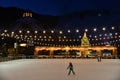 Stowe Mountain Ski Resort in Vermont, Ice Skating rink with one person at Spruce peak village at night Royalty Free Stock Photo