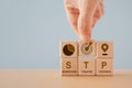 STP text ,abbreviation for Segmentation, Targeting, Positioning, and icon on wooden cube blocks. For marketing analysis, customer