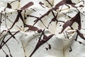 Stracciatella flavour gelato - full frame detail. Close up of a white surface texture of stracciatella Ice cream covered with