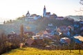 Straden village in fog church on the hill Royalty Free Stock Photo