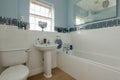 Half tiled white bathroom