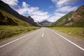 Straight asphalt road in the mountains Royalty Free Stock Photo